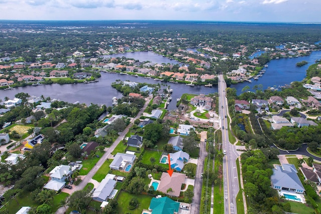 birds eye view of property featuring a water view and a residential view