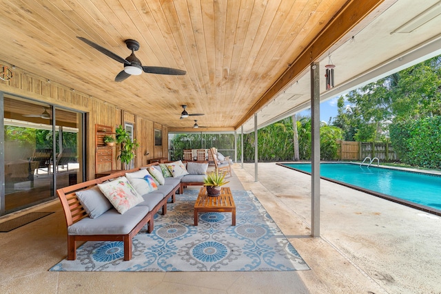 view of pool featuring a ceiling fan, a patio area, a fenced in pool, a fenced backyard, and an outdoor hangout area