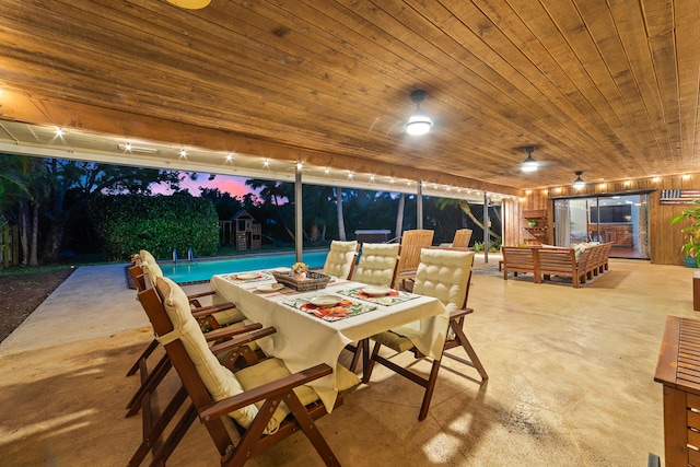 view of patio terrace at dusk