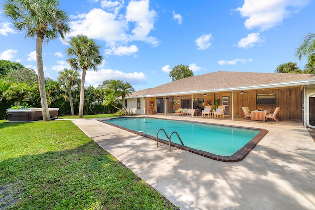 view of pool featuring a patio and a lawn