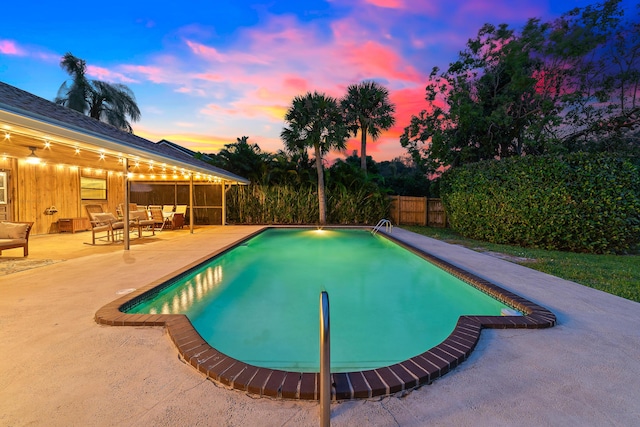 view of pool featuring fence, a fenced in pool, an outdoor hangout area, and a patio area