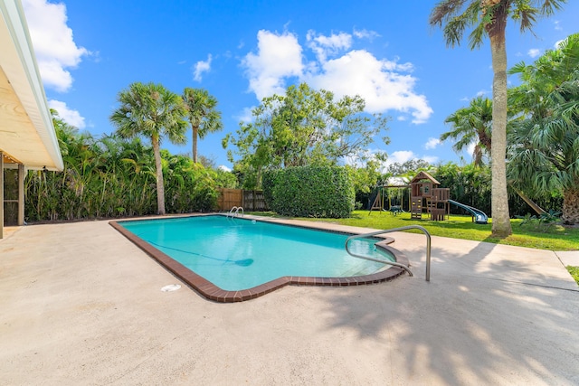 view of swimming pool with a fenced in pool, a fenced backyard, a playground, a yard, and a patio