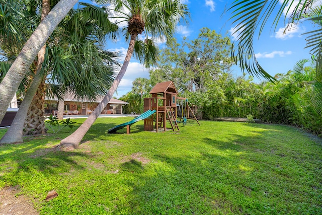 view of playground featuring a lawn