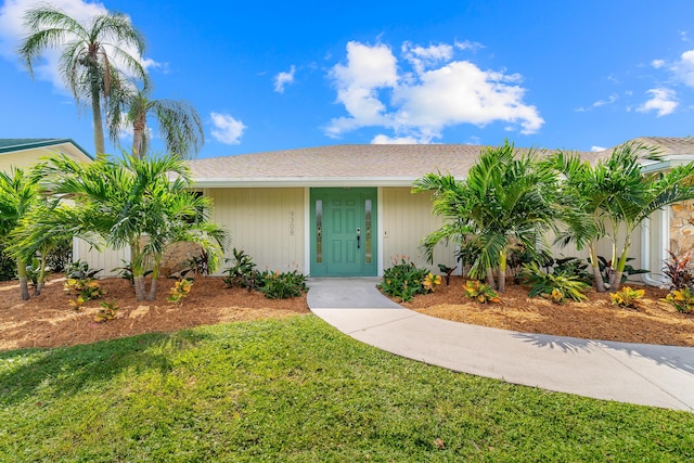 ranch-style house with a front lawn