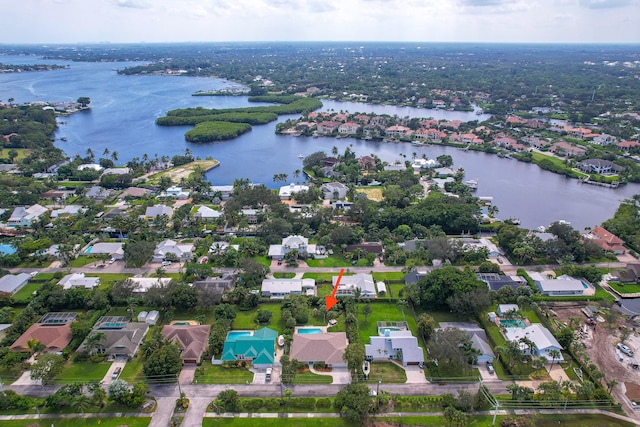 birds eye view of property with a water view