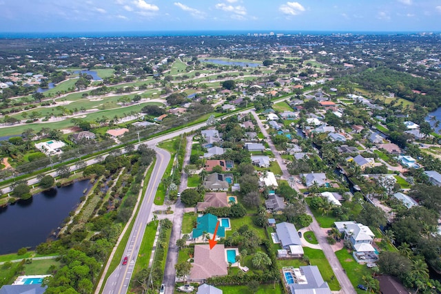 bird's eye view with a water view and a residential view
