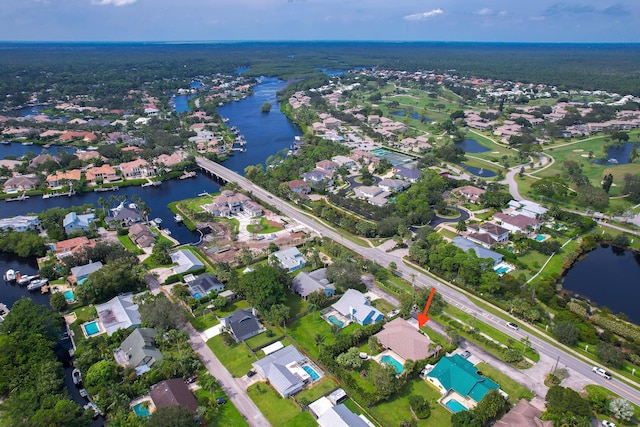 drone / aerial view featuring a water view and a residential view