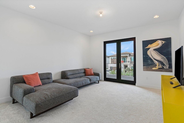 living room with french doors and carpet