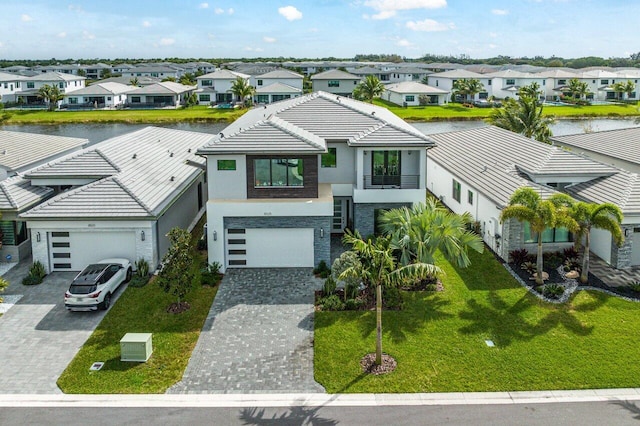 birds eye view of property with a water view