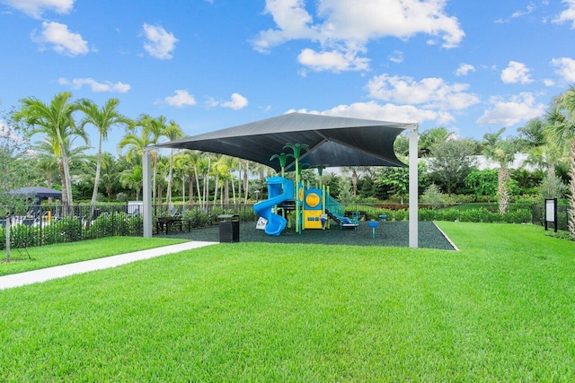 view of jungle gym with a lawn