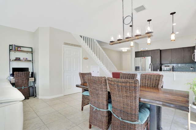 tiled dining room with sink