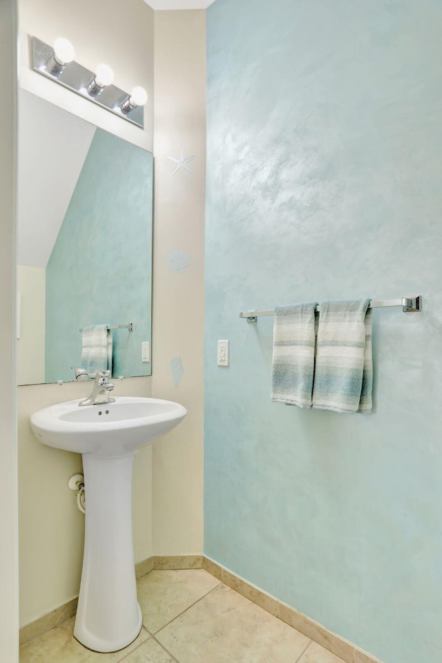 bathroom with tile patterned floors