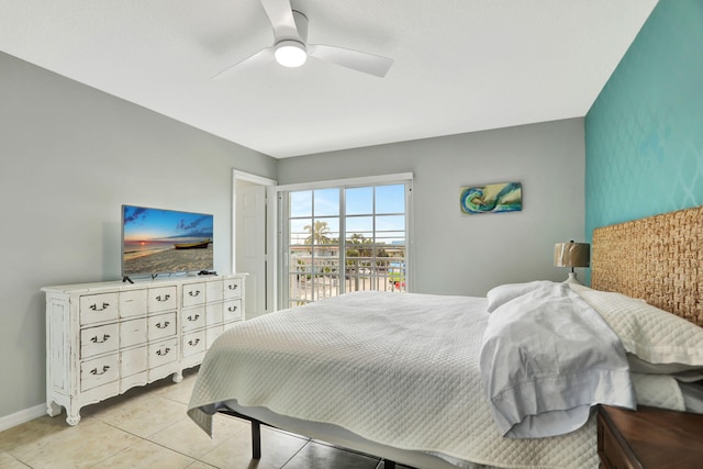 bedroom with ceiling fan and light tile patterned flooring