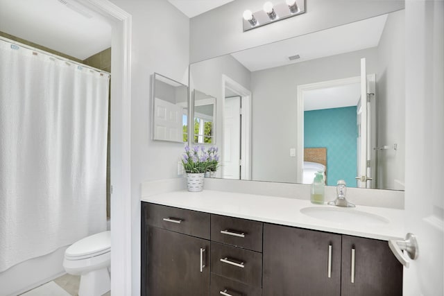 full bathroom with vanity, toilet, and shower / bath combo