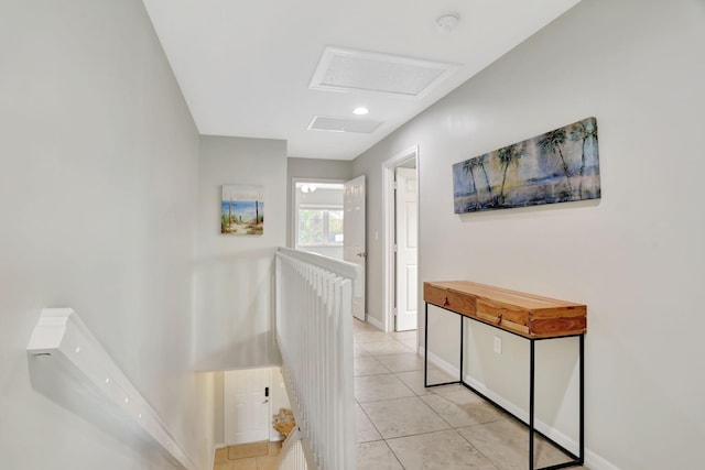 corridor featuring light tile patterned flooring