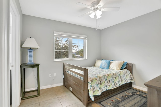 tiled bedroom with ceiling fan