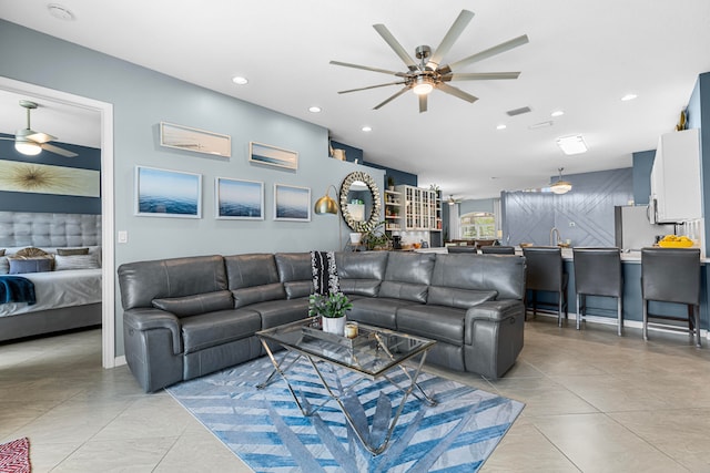 living room with light tile patterned flooring and ceiling fan