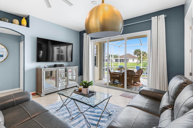 tiled living room with ceiling fan