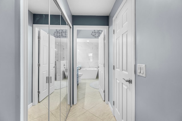 corridor with light tile patterned floors