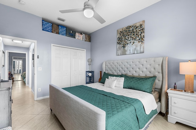 tiled bedroom with a closet and ceiling fan