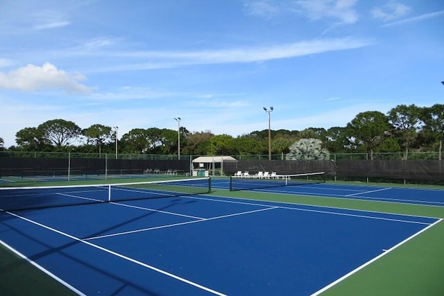 view of tennis court with basketball court