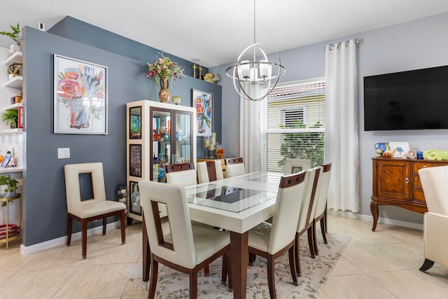 tiled dining area featuring a chandelier