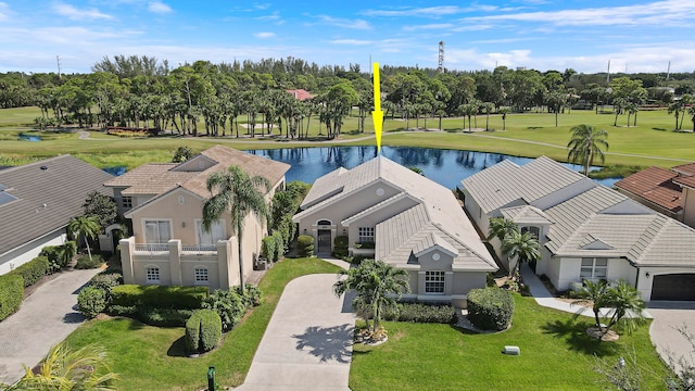 birds eye view of property with a water view