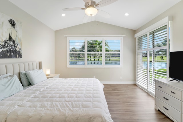 bedroom with lofted ceiling, wood-type flooring, and ceiling fan