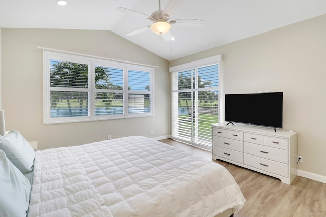 bedroom featuring multiple windows, light hardwood / wood-style floors, and ceiling fan