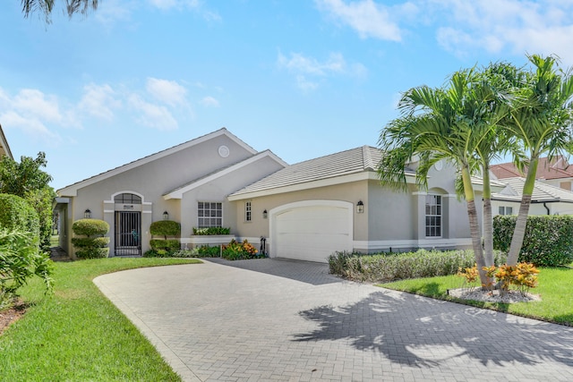 ranch-style house with a front lawn and a garage