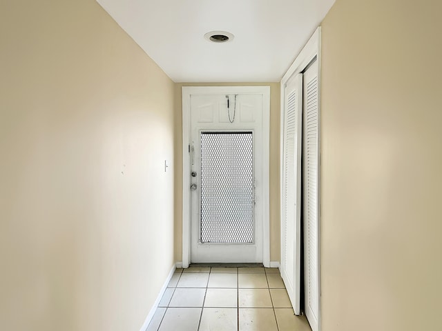 corridor with light tile patterned floors