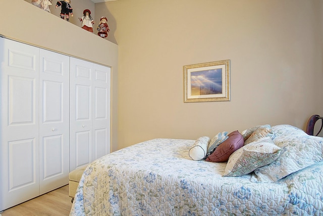 bedroom with a closet and light hardwood / wood-style floors