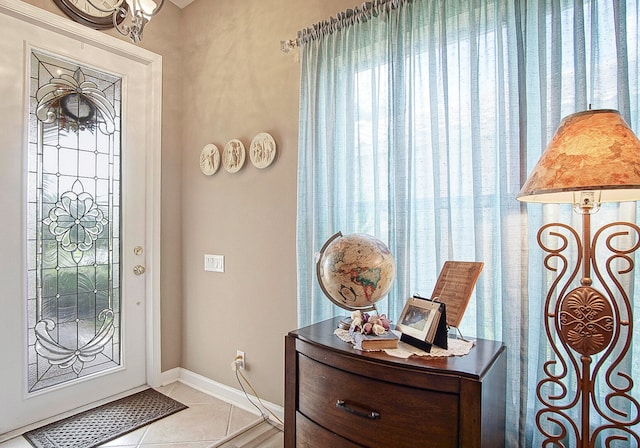 entrance foyer featuring light tile patterned floors