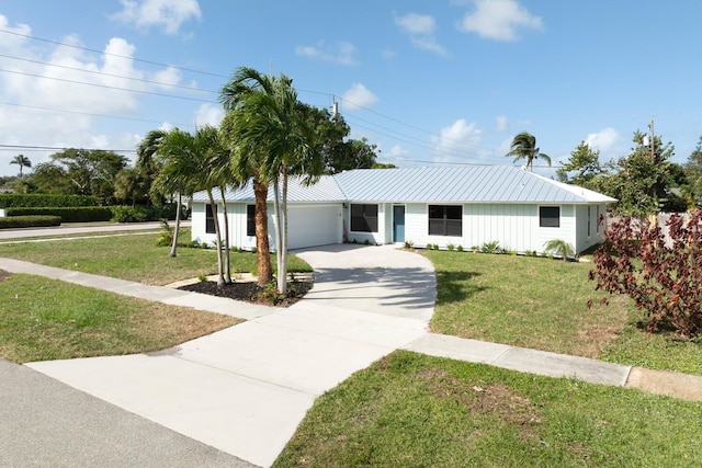 ranch-style home with a garage and a front yard