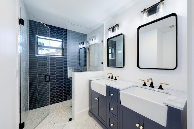 bathroom featuring vanity and tiled shower