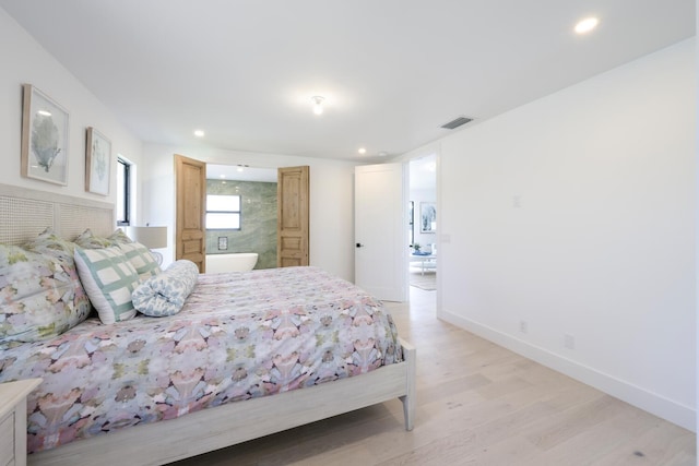 bedroom with light hardwood / wood-style floors