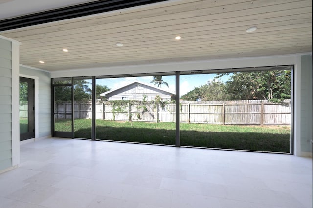 unfurnished sunroom featuring wooden ceiling