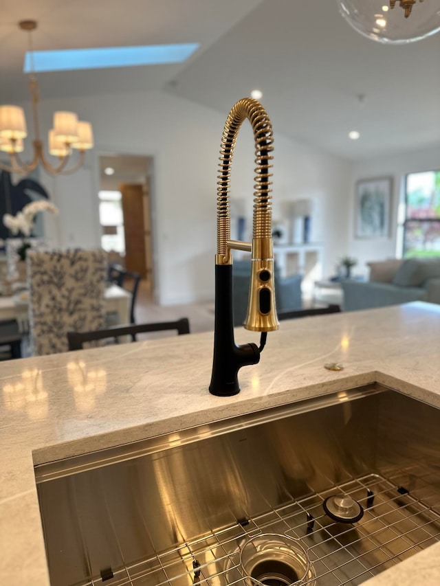 room details featuring sink and a skylight