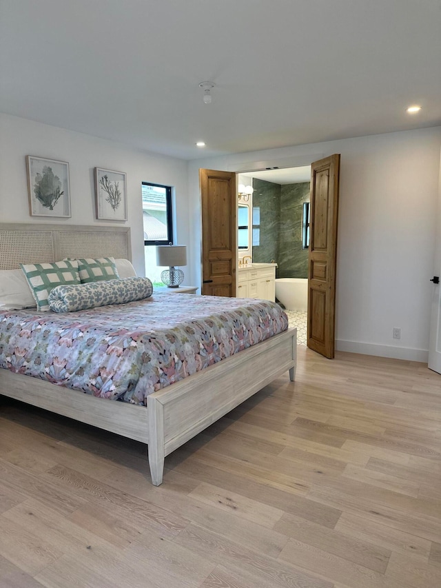 bedroom featuring light hardwood / wood-style floors