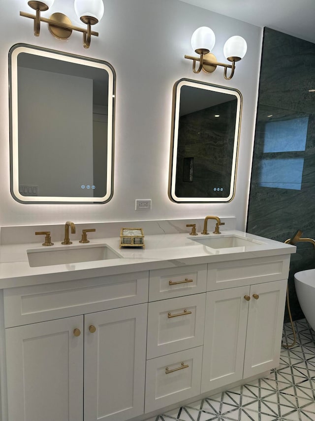 bathroom featuring vanity, tile patterned floors, and a bathtub