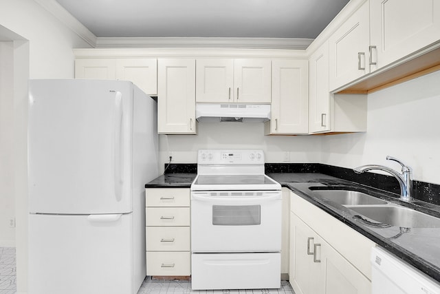 kitchen with dark stone counters, light tile patterned floors, sink, white cabinets, and white appliances