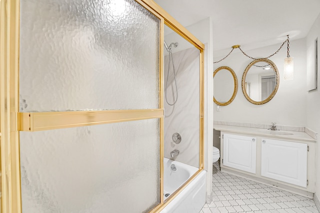 full bathroom with vanity, bath / shower combo with glass door, tile patterned floors, and toilet