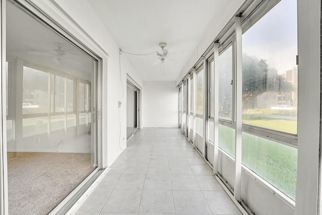 hallway with light tile patterned floors