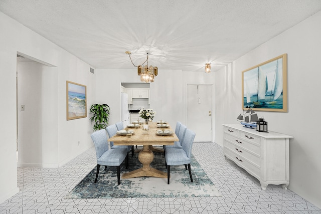 dining area with a textured ceiling