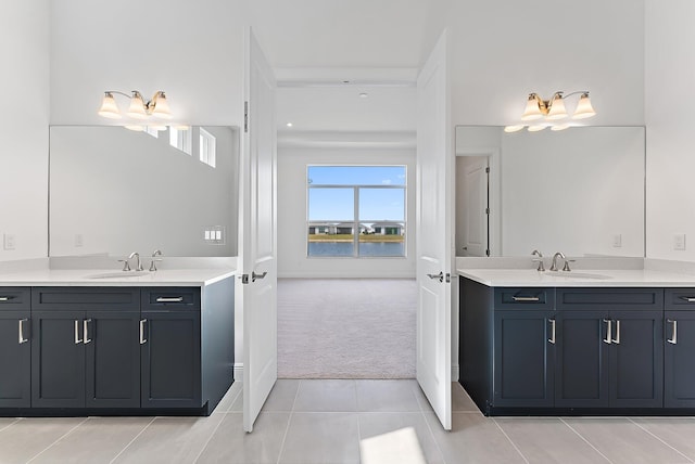 bathroom with tile patterned floors and vanity