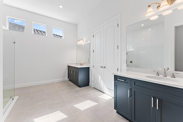 bathroom with vanity, tile patterned flooring, and walk in shower