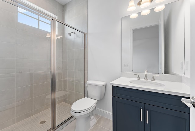 bathroom with vanity, tile patterned flooring, a shower with shower door, and toilet