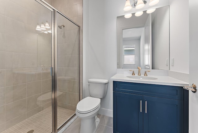 bathroom with a shower with door, vanity, and toilet