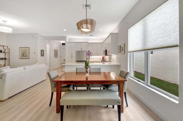 dining area with light wood-type flooring