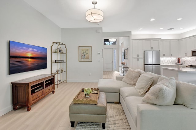 living room with light hardwood / wood-style floors